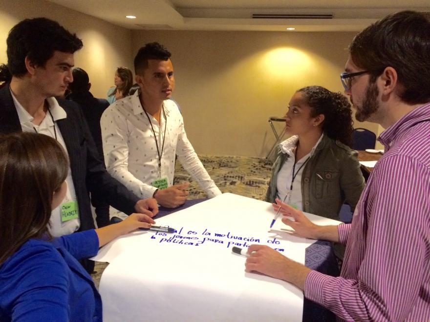 People standing around a table